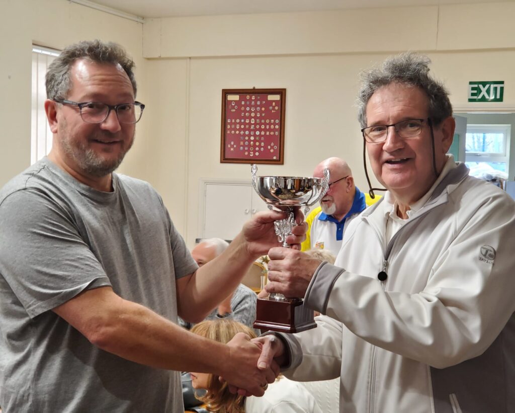 Kevin accepting the Newbie Competition Trophy from Bob